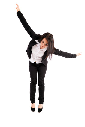 Full length portrait of a young businesswoman falling down